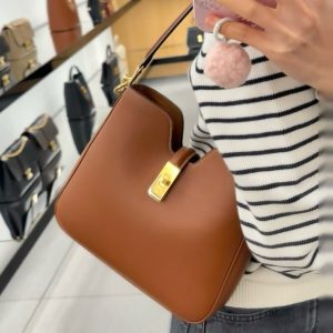 Korean-Style Light Luxury Bucket Bag with Lock Buckle, Women's Crossbody Shoulder Bag for Commuting, Niche Design 2025