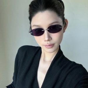 Retro Frameless Purple Small Oval High-End Sunglasses for Trendy Girls - European American Style, Perfect for Small Faces and Street Photography.