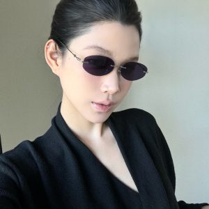 Retro Frameless Purple Small Oval High-End Sunglasses for Trendy Girls - European American Style, Perfect for Small Faces and Street Photography.