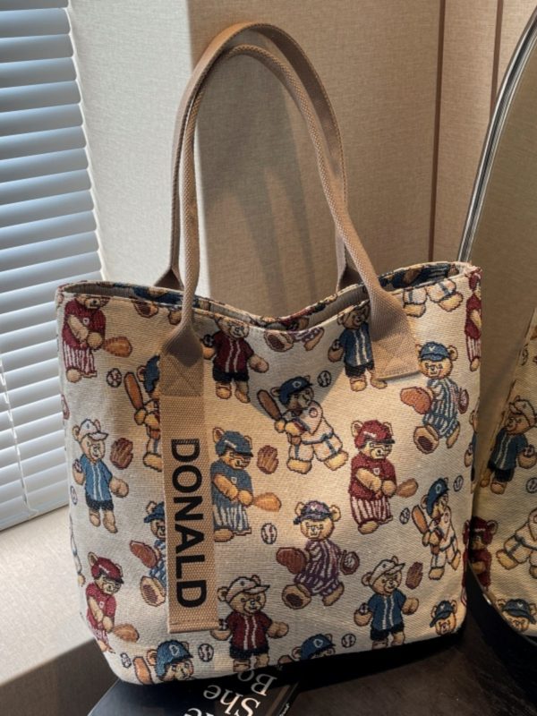 Womenâ€™s Niche Cartoon Canvas Tote Bag â€“ Large Capacity Spring 2025 Commuter Shoulder Bag for Students