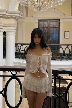 DreamyNerd Rosette Lace-Up Cardigan & Ruffle Mini Skirt Set – Ivory Whimsy