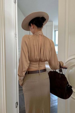 ROVENTE High Neck Tie Backless Blouse